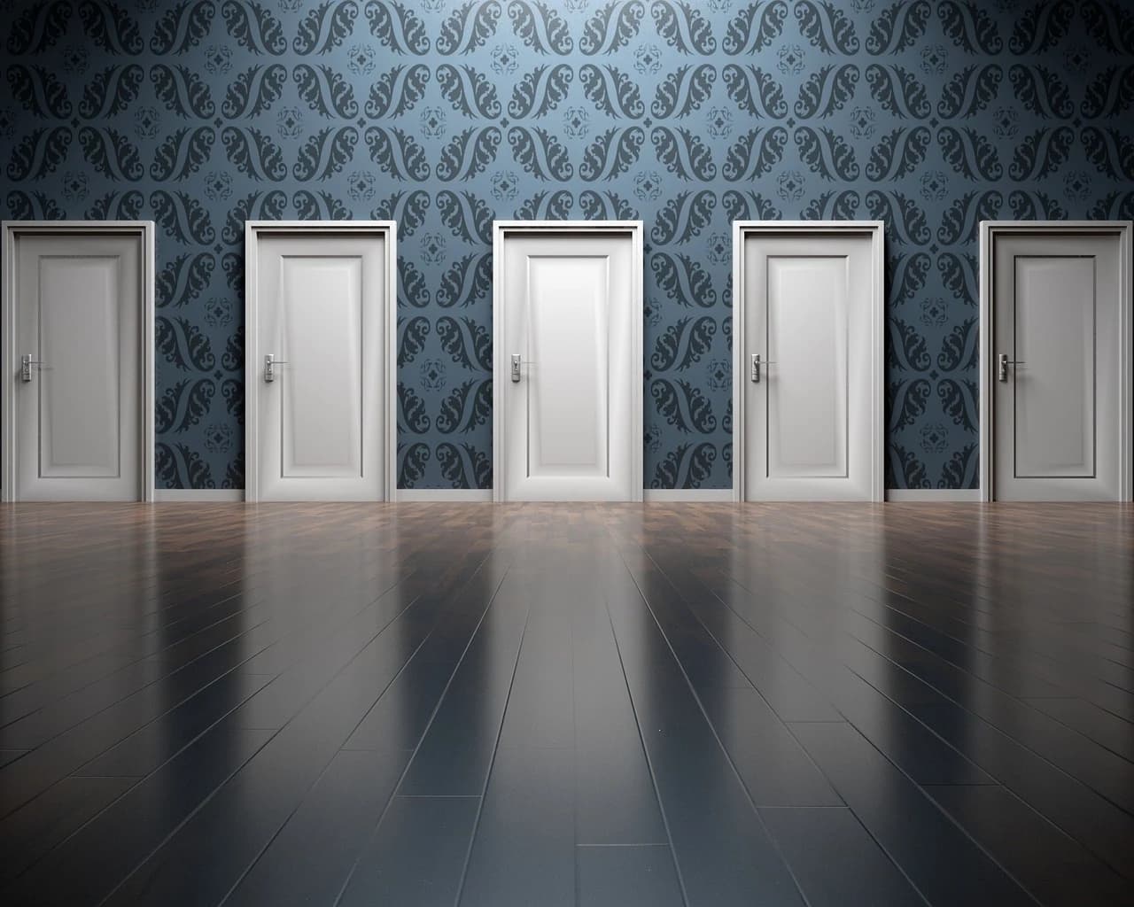 White doors lined against a patterned blue wall